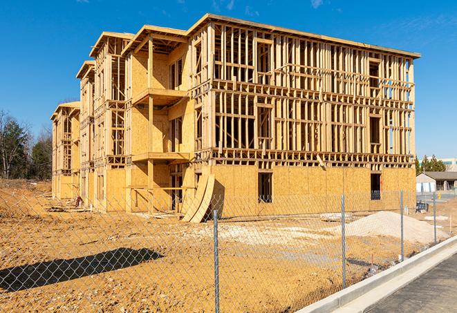 a temporary chain link fence winding around a construction site, outlining the project's progress in Silver Lake, KS